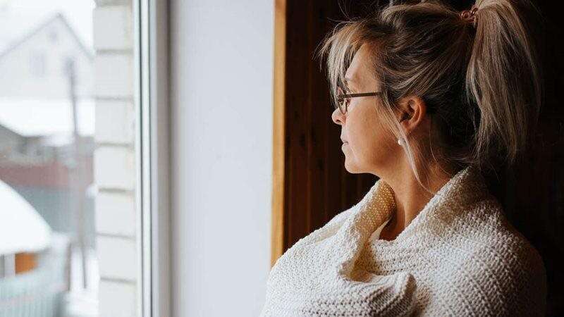 Depressed woman staring out the window